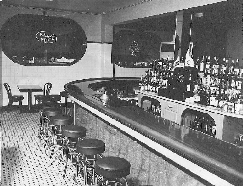 Nora's Cafe interior after renovations with Camden Beer neon sign in the window