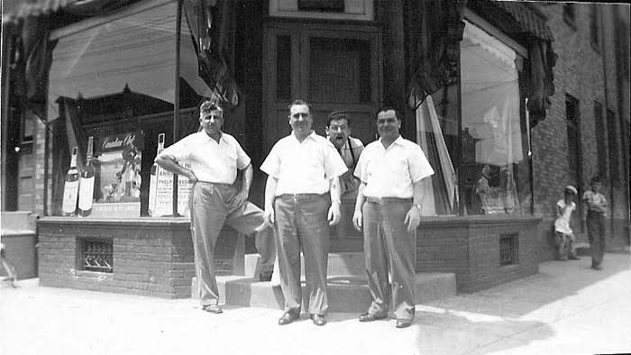 Fred and Mike Barbalace with two bartenders before renovations, about 1940