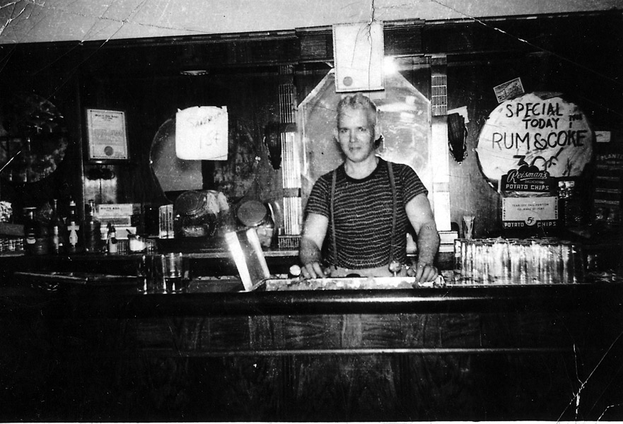 George Birch tending bar at The Silent Club