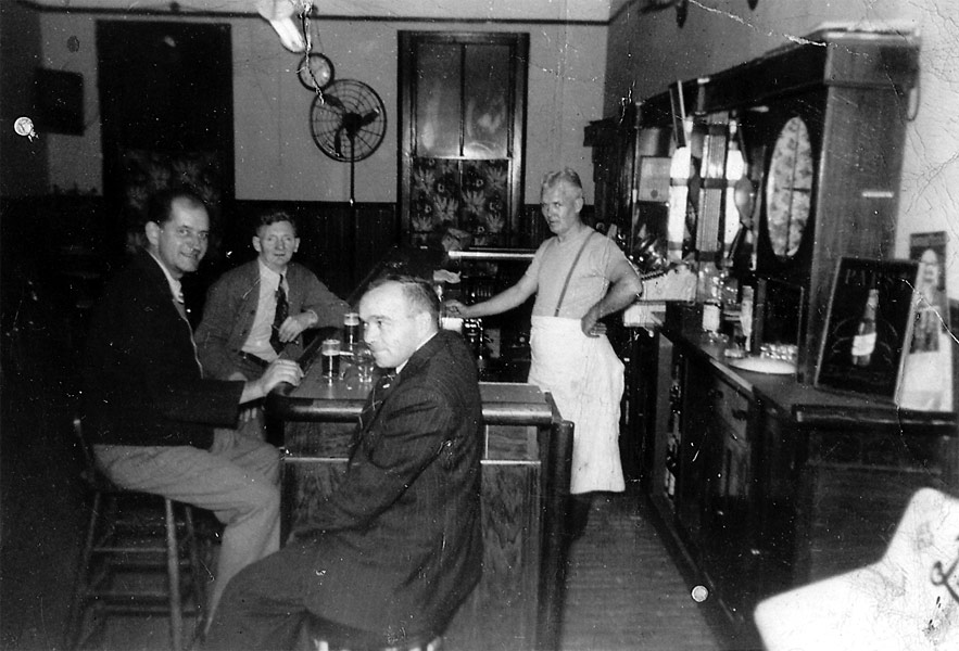 George Birch tending bar at The Silent Club