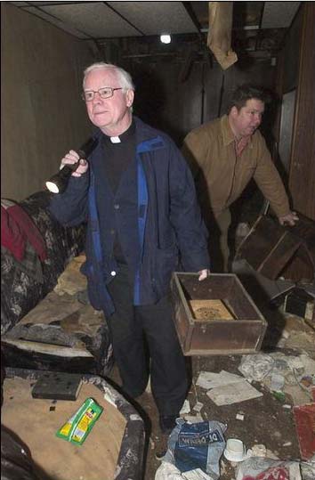 Msgr. Michael Doyle and playwright Joseph Paprzycki tour the vacant tavern at 400 Jasper Street, February 2006