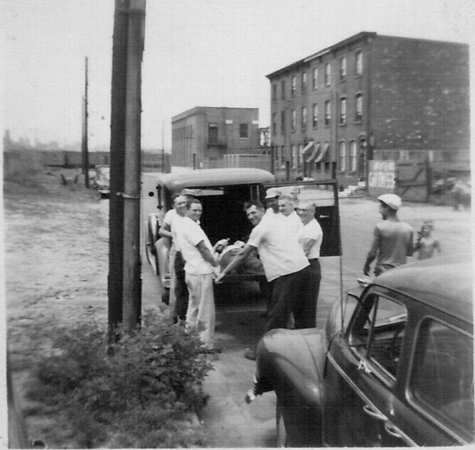 Kelly's Cafe at 69 State Street, taken from across the street — rowhomes at 49, 51, 53, and 55 State Street visible in background