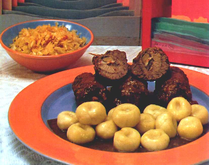 Kluski Silesian noodles with rolada meat, a traditional Polish dish
