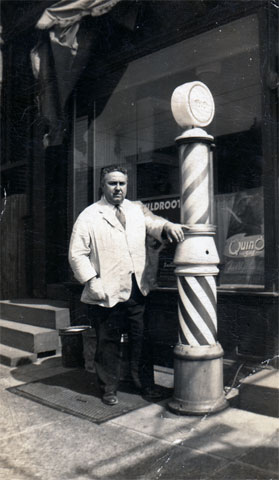 Dominick Lorusso outside his barber shop at 1640 Broadway