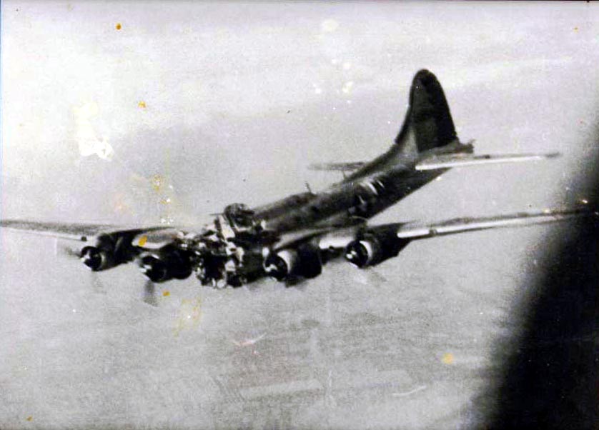The B-17 MIZPAH beginning to fall out of formation after the hit, July 14, 1944