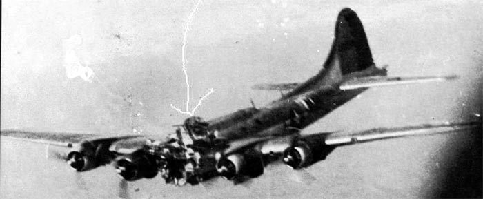 The B-17 MIZPAH falling further; arrow marks where Frank Gramenzi parachuted out