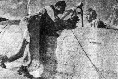 Lt. Bert Parks interviews Lt. Charles F. Heil in the cockpit, CBI Roundup, December 21, 1944