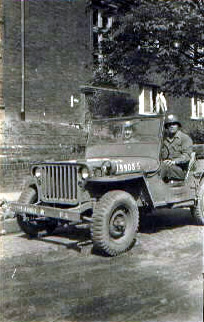 William Kiggins, Sr. in a military jeep during World War II