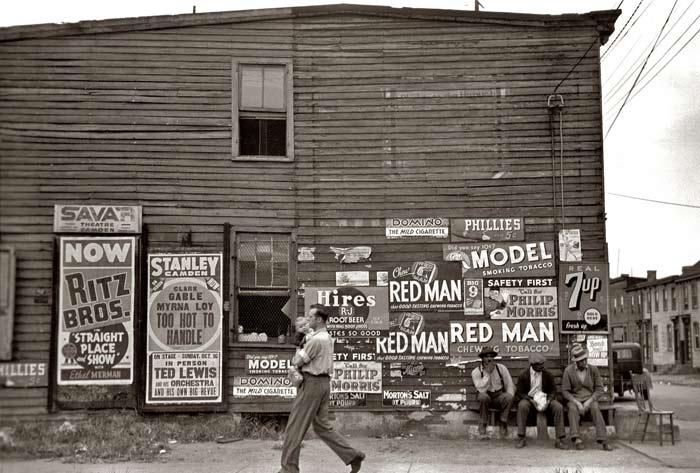 Street advertising for Camden theaters, October 1939, photo by Arthur Rothstein for the Farm Security Administration