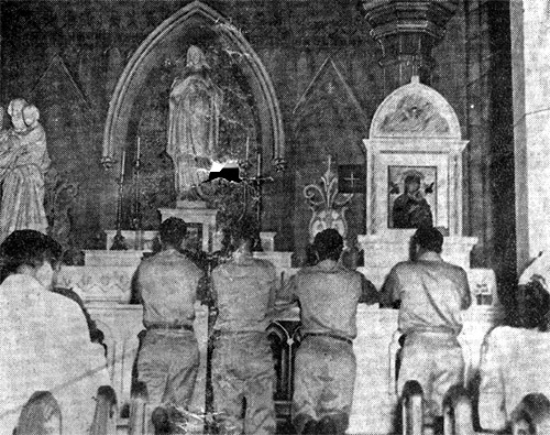 Four soldiers kneel at the altar of Immaculate Conception Cathedral on VJ Day, August 15, 1945