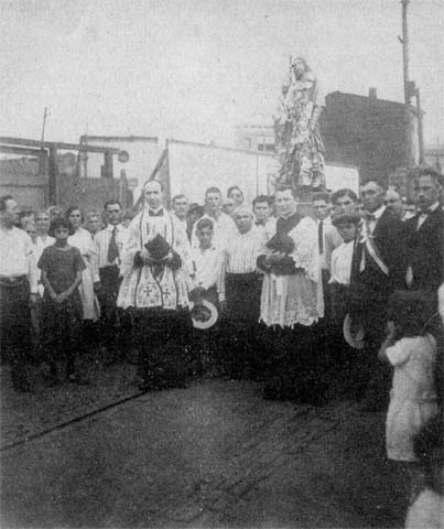 Father Brendan Shea leads a procession in honor of St. Rocco, 1926