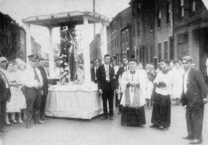 Father John Prosseda leads a procession in honor of St. Gabriel, 1929