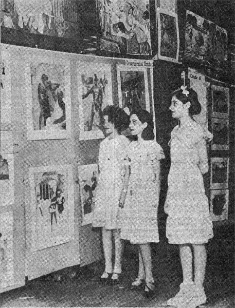 Phyllis Arters, Ray Koehl and Kathryn Schmidt, pupils at the Northeast School, inspecting a section of the exhibit of Camden Public School Art