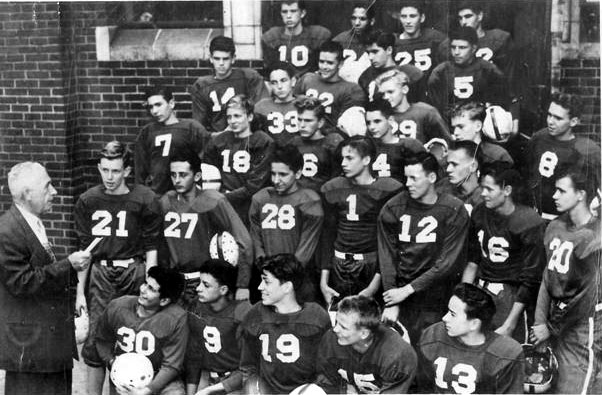 Camden Catholic High School freshman football team, 1953 — Coach Dr. Ethan Lange outside Camden Catholic at Broadway and Federal Street