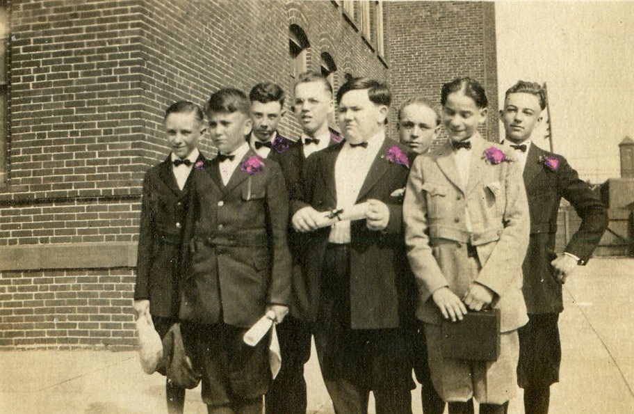 Washington Elementary School boys schoolyard looking east towards River Avenue, circa 1912. Third from left is Raymond Curtis.