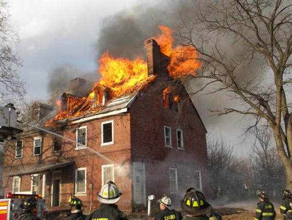 Firefighters battling a fire that gutted the Samuel Cooper House at 1102-1104 North 22nd Street, 2008