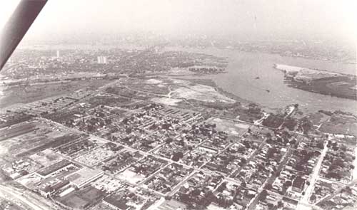 Aerial view looking west from about North 24th Street and Howell Street, July 1965