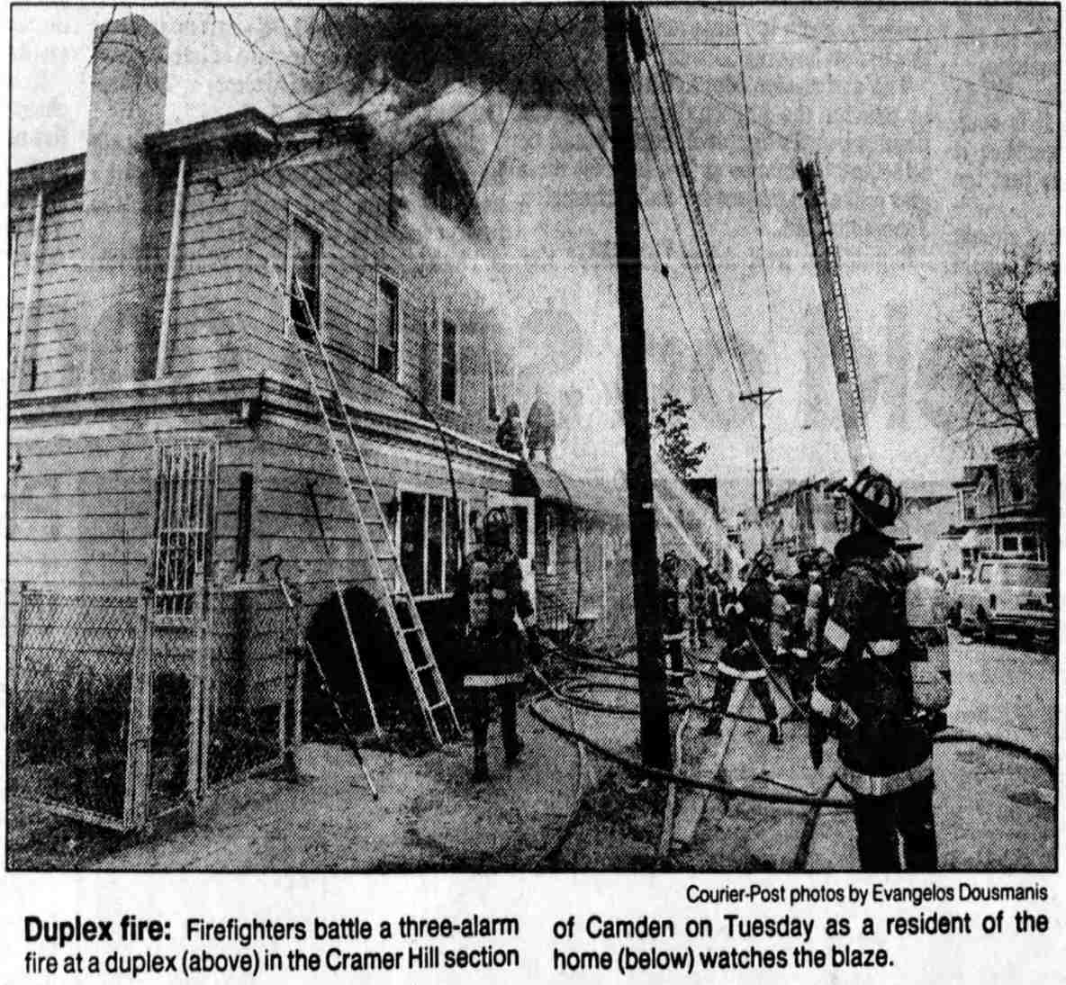 Camden Fire Department members at work extinguishing fire at 909-911 North 24th Street, December 17, 1991
