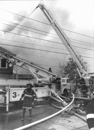 Ladder 3 and Ladder 1 combating Third Alarm fire at 909-911 North 24th Street, December 17, 1991
