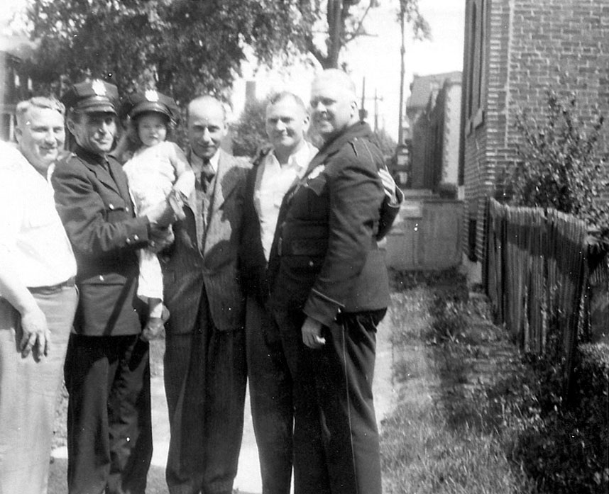 Emil Friedrichs at far left with his daughter, 1031 North 25th Street, 1940s