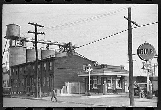 Camden coal yard at 204 to 212 Mechanic Street, October 1938, showing the Gulf Service Station at Ferry Avenue and the Boudov Coal & Ice Co. building at 212 Mechanic Street