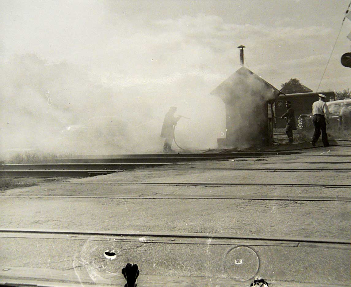 Camden Fire Department at the railroad crossing guard shack, sometime after 1956, photo 1