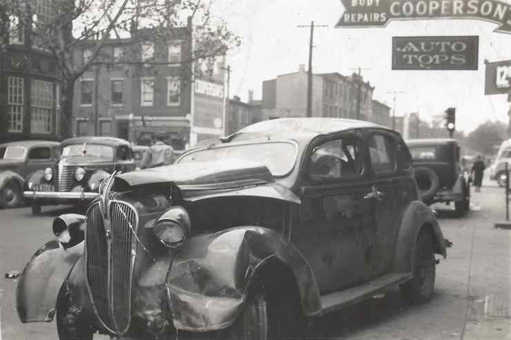 Wrecked automobiles outside Cooperson Bros., Fourth Street