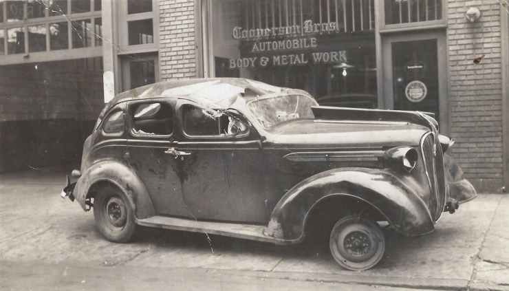 Wrecked automobiles outside Cooperson Bros., Fourth Street