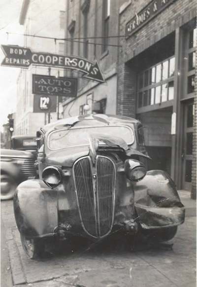 Wrecked automobiles outside Cooperson Bros., Fourth Street
