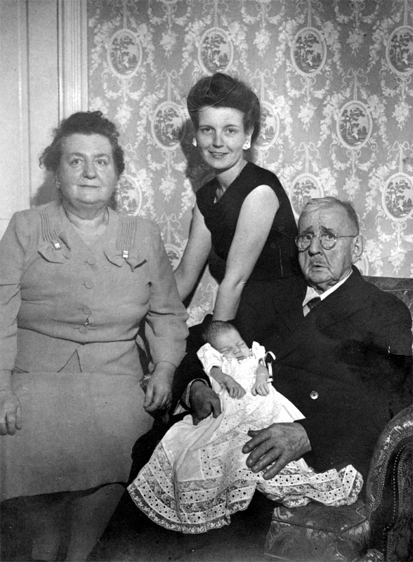 Louis Charles DeLisle with family at his home, 1945