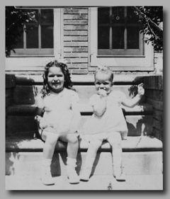 Charles Wexlin at the register at M&H Sweet Shop, and his daughters on the steps at 254 Boyd Street