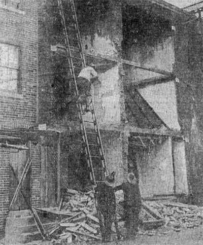Wreckage of 829 and 831 Bridge Avenue after the front walls collapsed, June 1933