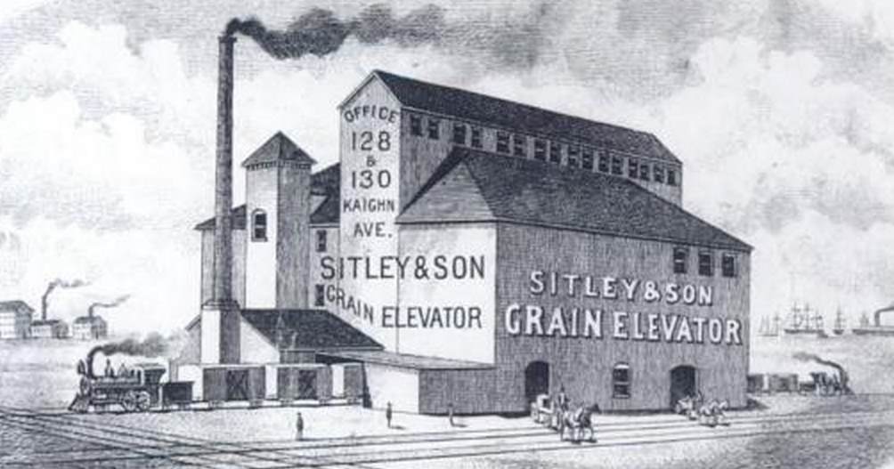 Sitley and Son grain elevator and warehouse, 600 block of Chelton Avenue, postcard view