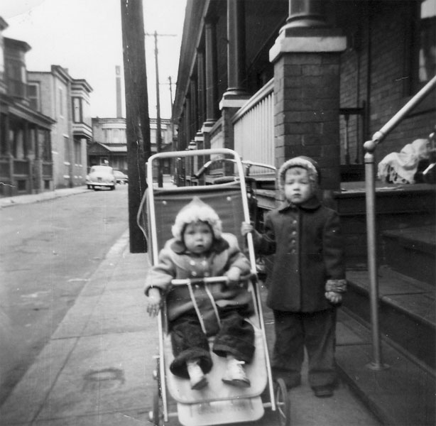 Linda Boris (in stroller) and Chris Boris in front of 716 Grant Street, April 1956