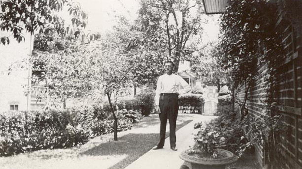 Charles (Carl) Kellman Sr. in side yard looking towards High Street