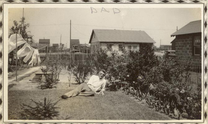 Carl Kellman Sr. in side yard looking from High Street
