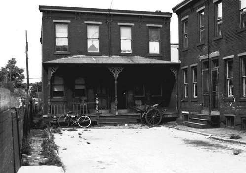 Looking west on Bella Place from 833 Bella Place, showing 832 and 830 with porches, and 753 and 755 at right
