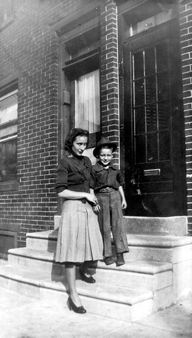 Cora 'Peggy' Peacock Carll and Jack Carll on the stoop of 910 Howard, 1941