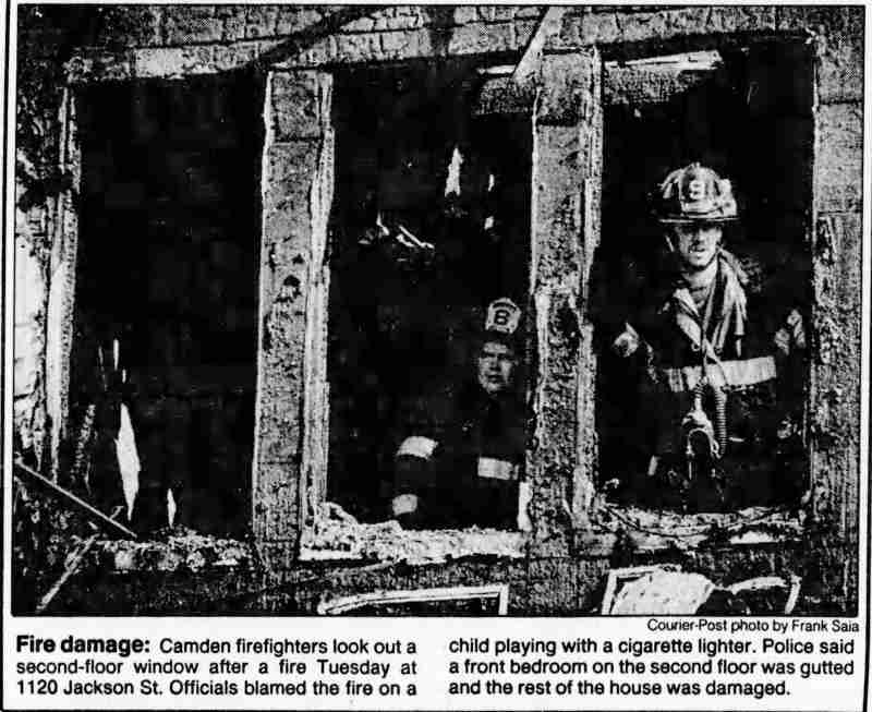 1990 Courier-Post photo of firefighters at 1120 Jackson Street fire, child playing with lighter