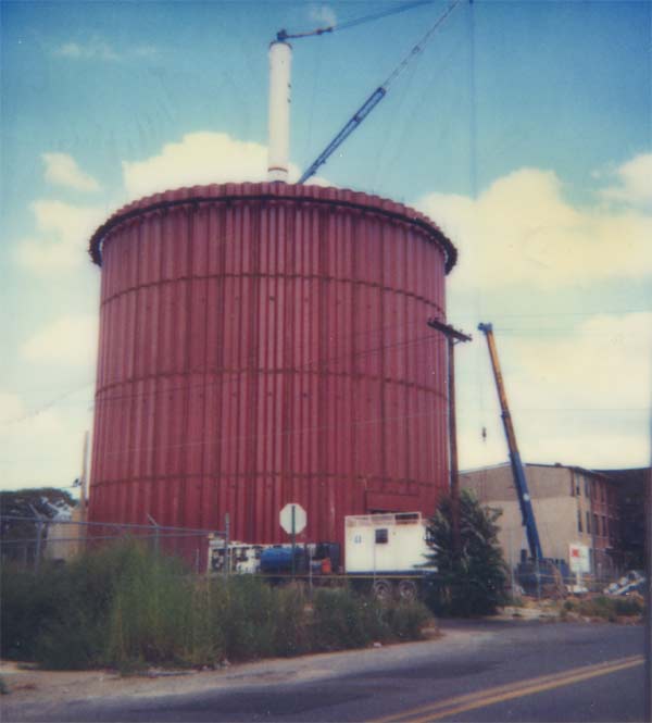 251–259 Kaighn Avenue with water tower under construction, July 1984