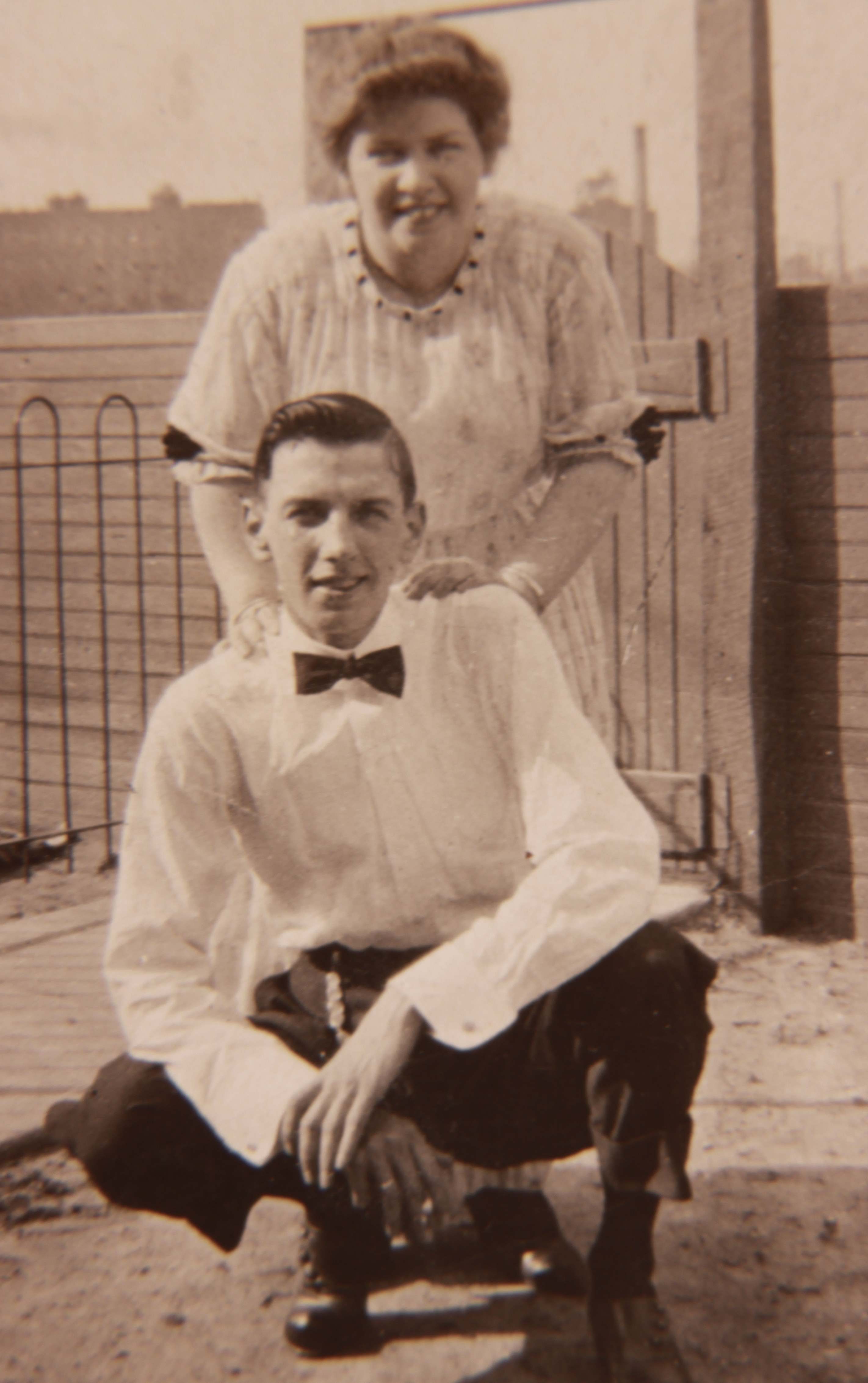 Robert and Anna Armstrong, 1916, with Camden High School visible in the background