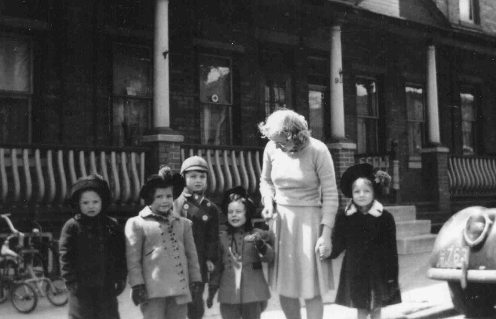 Barbara Ann Howe with her grandmother and friends, 900 Lawrence Street, c. 1947-1949