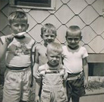 George Wagner, Jim Hayes, and 'Six-Gun Jim' Richardson; Dave Mandruke in front — 1102 Lois Avenue, circa 1955