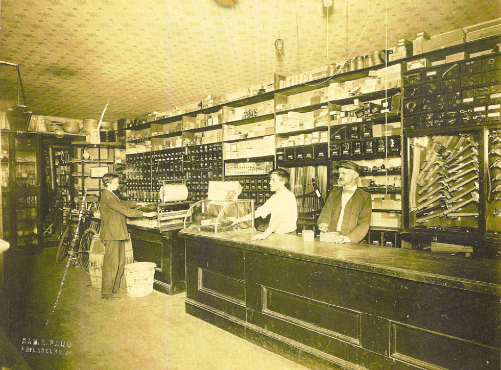 Victor J. Paxson and Charles G. Paxson at Paxson Hardware, 132 Main Street