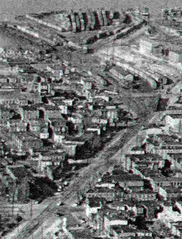 1952 aerial view of Main Street between Point Street and 5th Street, showing the railroad yard and Vine Street Ferry Terminal grounds
