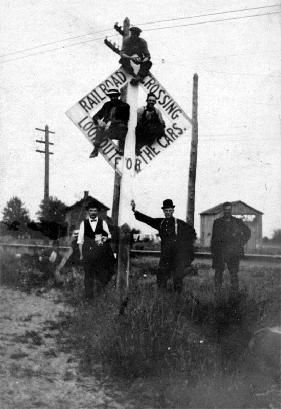 William Heineman and companions at an unnamed railroad crossing in Camden, circa 1890s