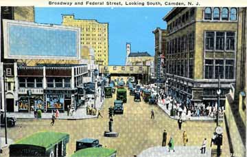 Broadway looking south from Federal Street — the Chinese Wall elevated railroad is visible at end of block
