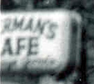 Sign outside the bar reading Sherman's Cafe, 1952