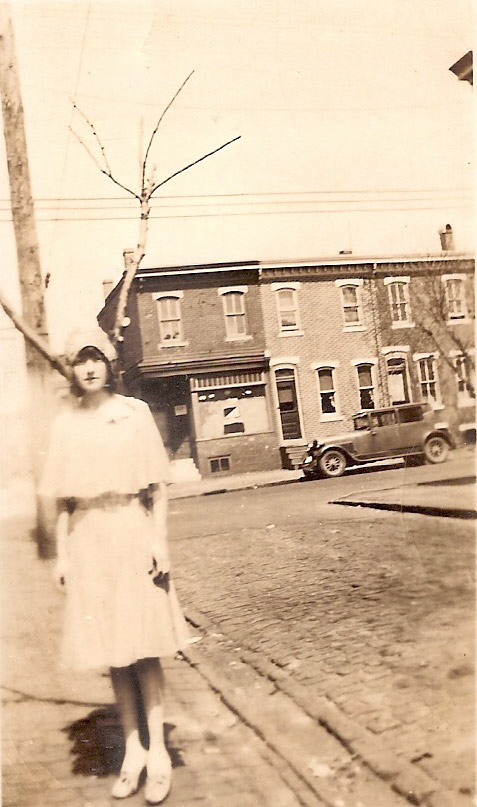 Catherine McGrath at 605 St. John Street, with 545–549 Royden Street visible in background