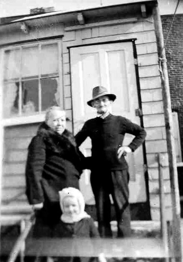 Joseph and Katie Bittmann on the back steps of 1815 Tioga Street, January 1945